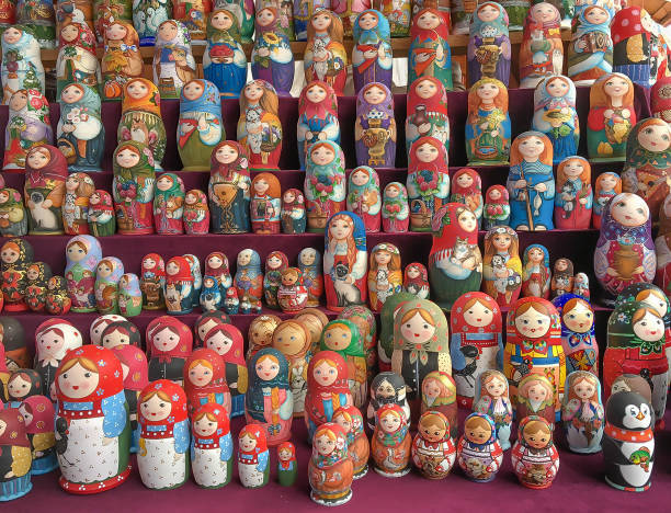 Beautiful colourful wooden dolls matryoshka at market MOSCOW, RUSSIA-MAY 27, 2017:Beautiful colourful wooden dolls matryoshka at market. Matryoshka dolls is folks cultural symbol of Russia russian nesting doll russia doll moscow russia stock pictures, royalty-free photos & images