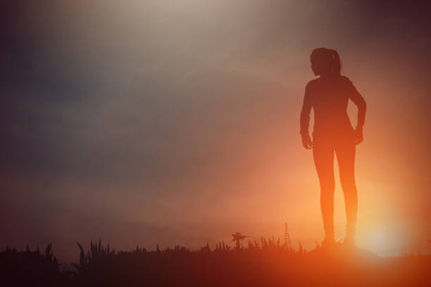 istock silhouette of a happy people and sunset 817131366