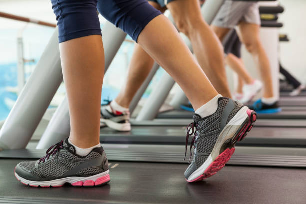 istock Row of people working out on treadmills 817131394