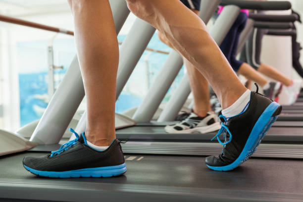 istock Row of people working out on treadmills 817131426