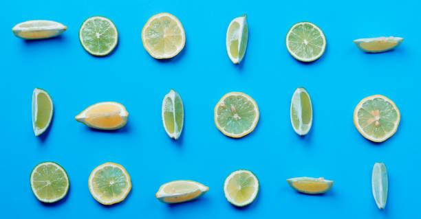 istock Above view at cutted lemons and limes 817136092