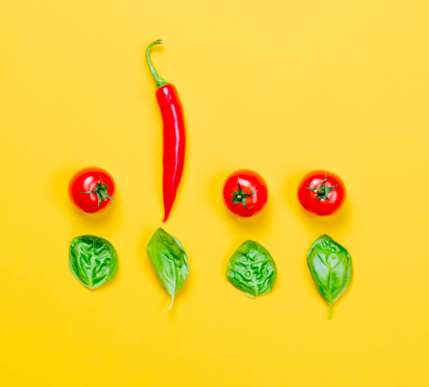 istock Above view at Chili pepper and tomatoes with basil 817136270