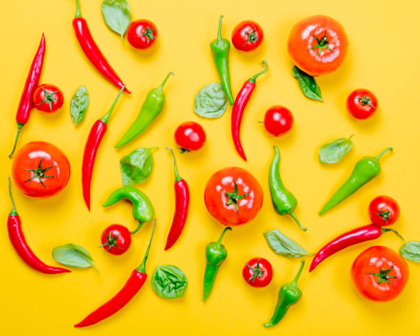 istock Above view at Chili pepper and tomatoes with basil 817136292