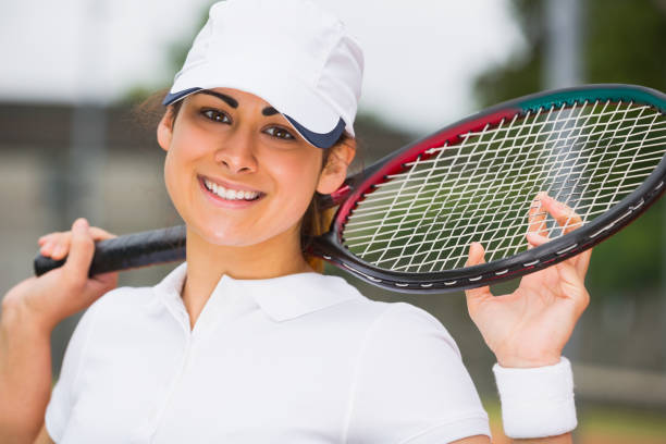 istock Pretty tennis player smiling at camera 817156806