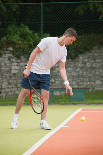 istock Young tennis player about to serve 817166884
