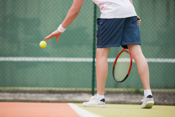 istock Young tennis player about to serve 817167008