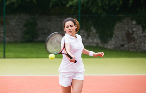 istock Young tennis player hitting ball 817167120