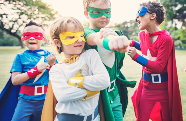 istock Superheroes Cheerful Kids Expressing Positivity Concept 817169504