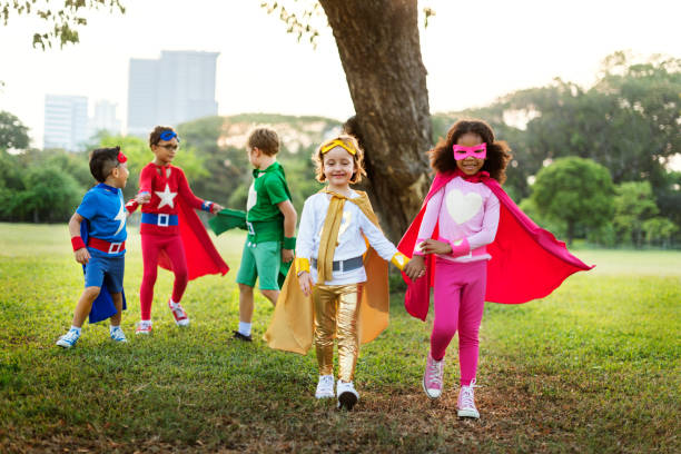 istock Superheroes Cheerful Kids Expressing Positivity Concept 817171778