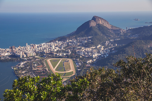 Two brothers mountain, Jockey Club Brasileiro and Atlantic ocean in Rio de Janeiro, Brazil. Aerial view during the day.