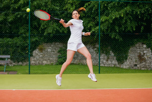 istock Pretty tennis player about to hit ball 817180312