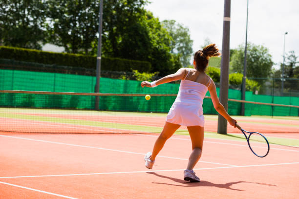 istock Pretty tennis player hitting ball 817183028