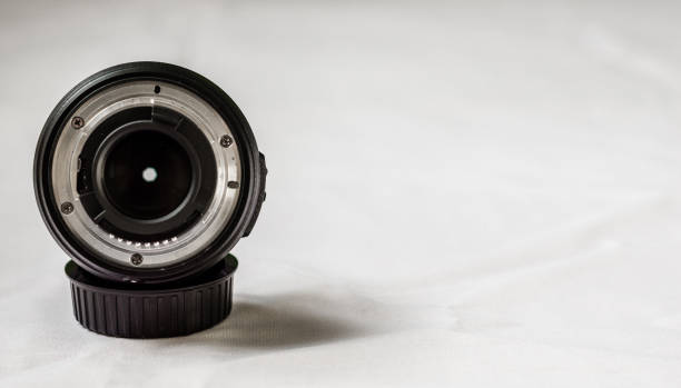 istock Close up of a prime camera lens against white background. Selective focus 817183752