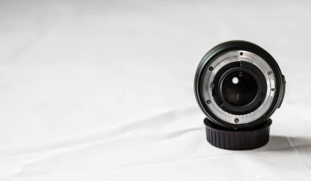 istock Close up of a prime camera lens against white background. Selective focus 817183768