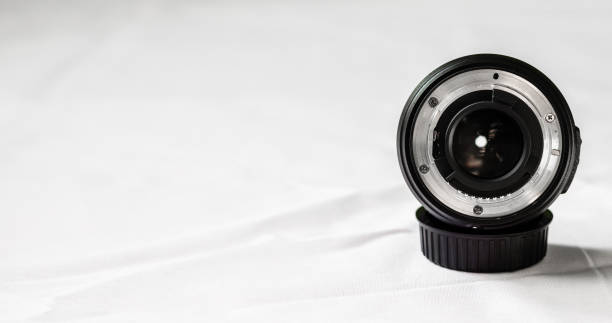 istock Close up of a prime camera lens against white background. Selective focus 817183776