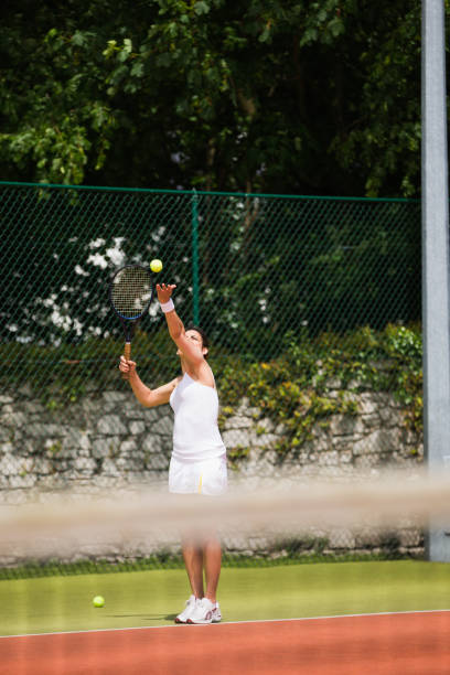 istock Pretty tennis player about to serve 817183782