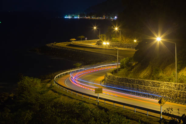 istock curved road by the sea. 817188702