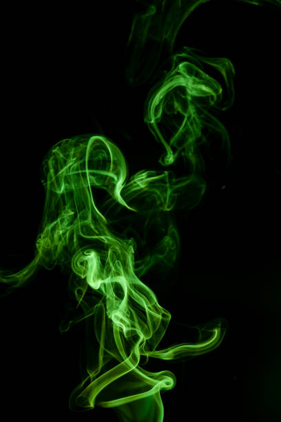 istock Green smoke movement on black background. 817191092