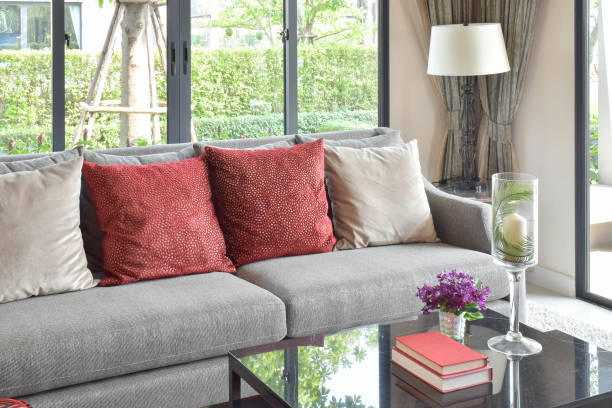 istock modern living room design with red pillows on sofa and decorative table lamp 817191346