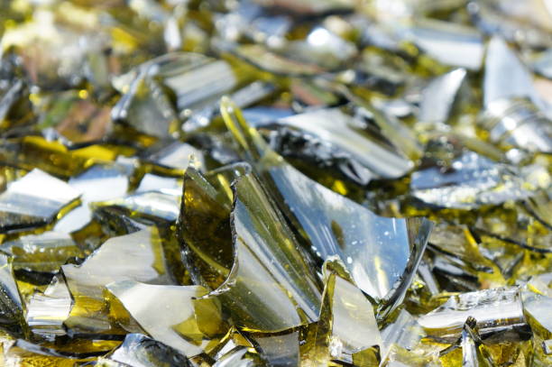 istock Fragments of colored broken glass on a concrete surface 817193410