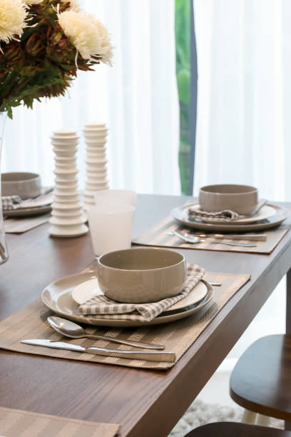 istock modern dining room interior with table set on wooden table 817193538