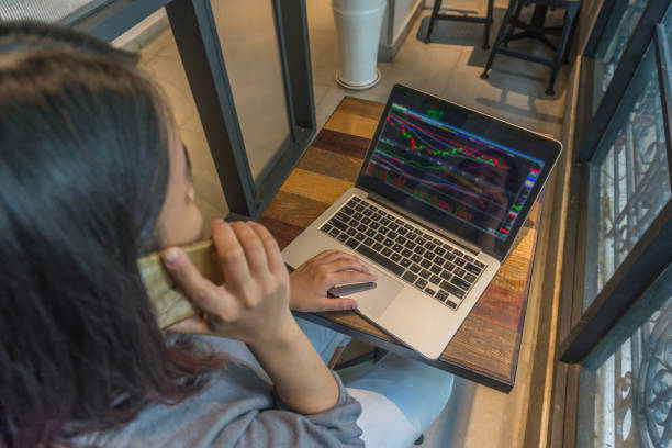 istock Stock Trader analyzing stock market and make a phone call 817193626