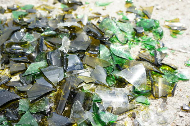 istock Fragments of colored broken glass on a concrete surface 817193662