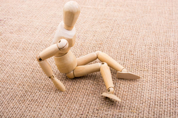 istock Wooden dolls posing on canvas 817193814