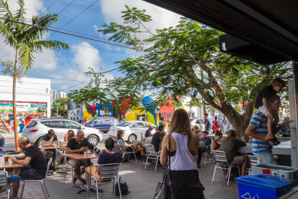 Wynwood Miami Florida Miami, FL, United States - January 2, 2015: People relaxing in Pathern's coffee. Wynwood has a lot coffee shops and design stores to take a culture tour on your vacation time. wynwood walls stock pictures, royalty-free photos & images