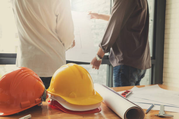 istock Engineer and Architect concept, Engineer Architects office team working with blueprints, Vintage Effect 817203292