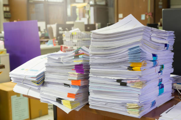 istock Pile of unfinished documents on office desk, Stack of business paper 817203520