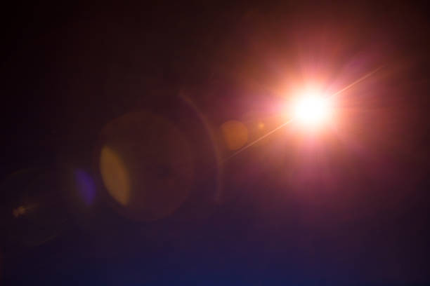 Photorealistic lens flare isolated on black background