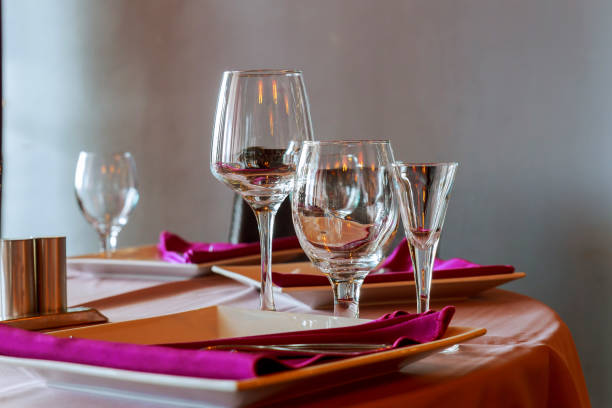 istock Glasses, flower fork, knife served for dinner in restaurant 817203584