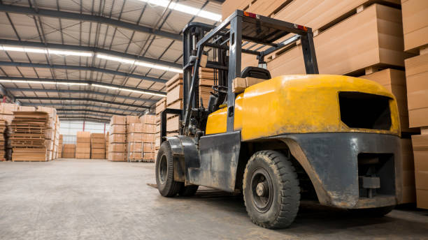 istock Yellow forklift in a large warehouse. Industry concept. 817206132