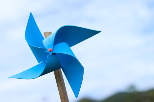 istock wind turbine toy with sky , save energy concept. 817208842