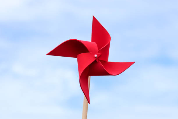 istock wind turbine toy with sky , save energy concept. 817208846