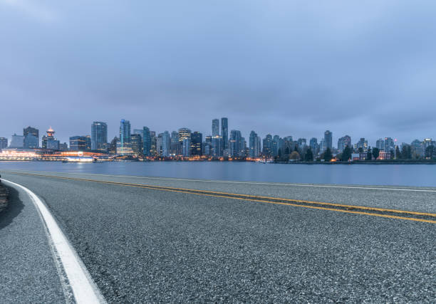 istock illuminated vancouver downtown skyline with empty highway on foreground 817213456