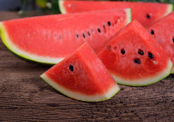 istock portion cut fresh watermelon with seed on wooden table 817219178