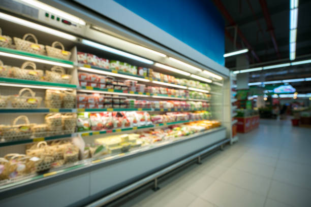 istock Supermarket blurred background with colorful shelves and unrecognizable customers 817223928
