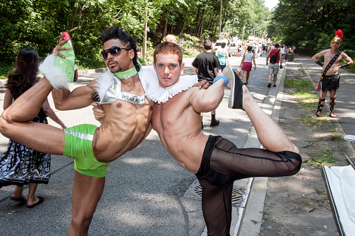 Paarticipants in the annual 2006 Toronto Pride parade, during at time out for a photo in the marshalling area for the main parade showing off their muscular bodies. Toronto Pride is a significant gay, human rights and cultural event for North America.