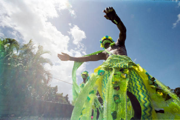 Trinidad Carnival 2006 Moko Jumbies Colourful and powerful Moko Jumbies, stilt walkers, racing to the Savannah in Port of Spain on Monday of Trinidad Carnival in 2006. Moko Jumbies come from an African tradition and there are schools for youth in the city in the craft. port of spain stock pictures, royalty-free photos & images