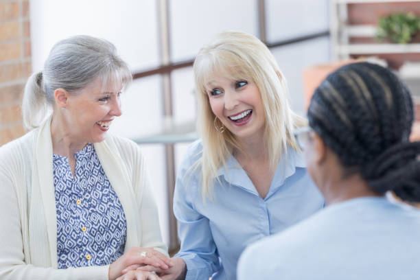 istock Small group leaders greet each other at senior meeting 817246278