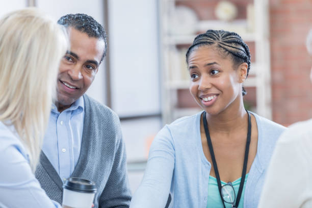 istock Community center employees discuss senior meeting entertainment issues 817246316