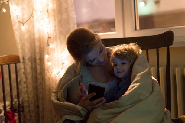 istock Mother and son looking at mobile phone 817247110