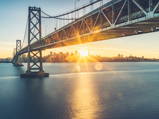 view of bay bridge and san francsico city skyline from yerba buena island - urban bridge imagens e fotografias de stock