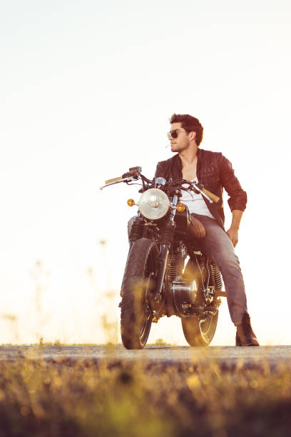 istock Biker man sits on a bike 817276848