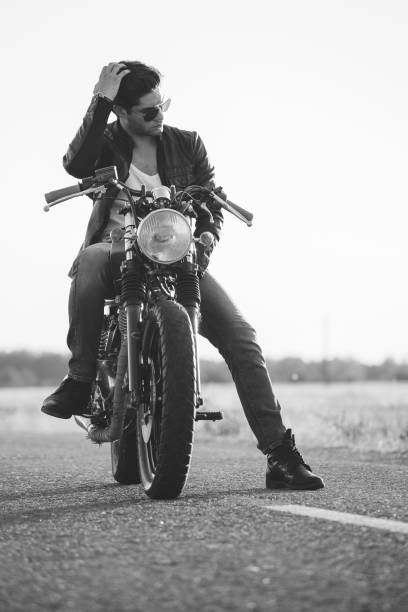 istock Biker man sits on a bike 817276902