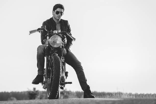 istock Biker man sits on a bike 817277430