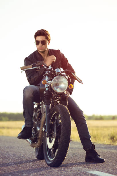istock Biker man sits on a bike 817279574
