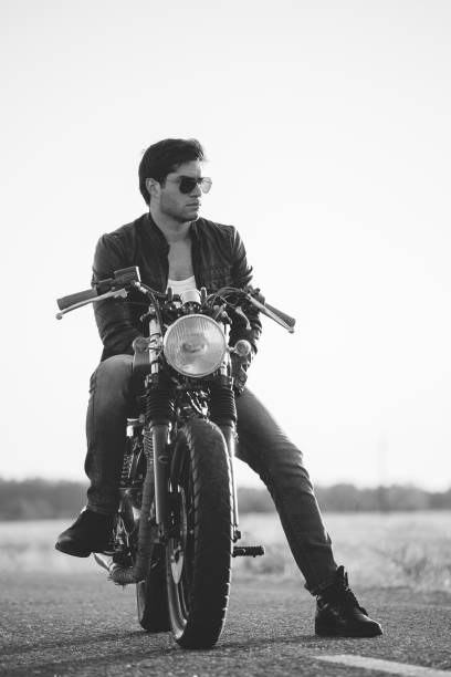 istock Biker man sits on a bike 817280392